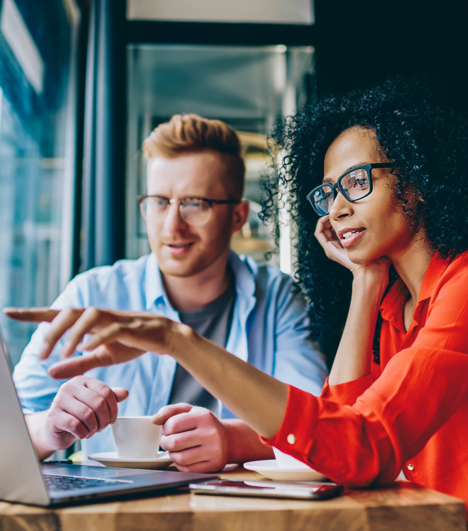 Man and woman looking at laptop screen