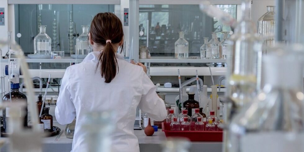 A women in a lab coat working in a laboratory